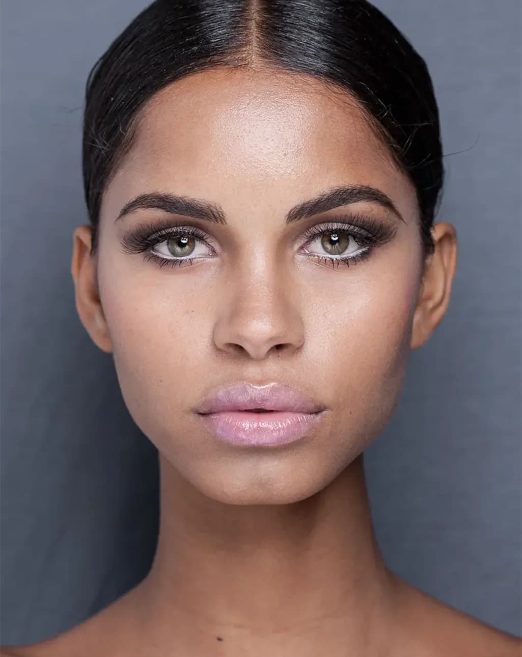 Before Woman with dark hair and skin